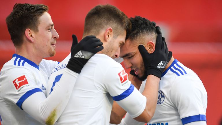 Nabil Bentaleb is mobbed after his strike for Schalke against Bayer Leverkusen
