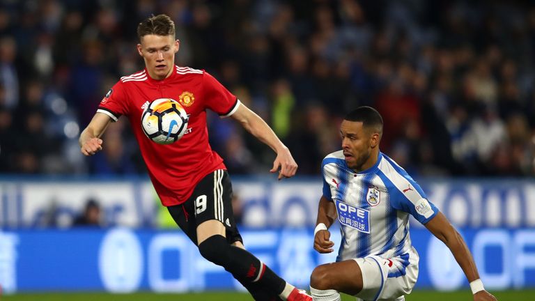 HUDDERSFIELD, ENGLAND - FEBRUARY 17:  Scott McTominay of Manchester United and Mathias Jorgensen of Huddersfield Town battle for the ball during the The Em