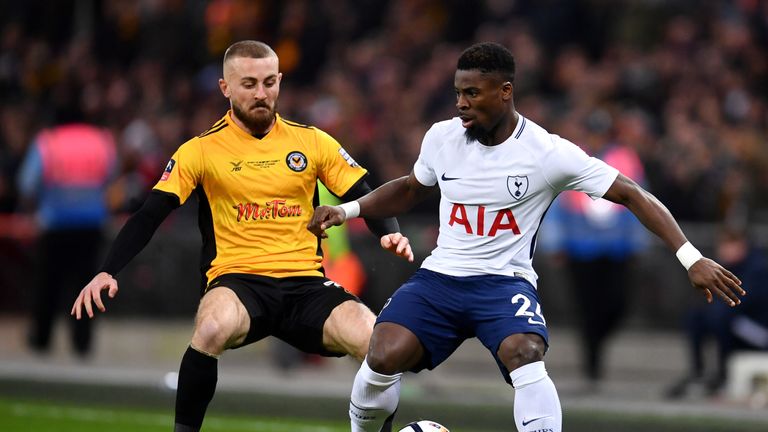 Serge Aurier holds off Dan Butler in the first half at Wembley