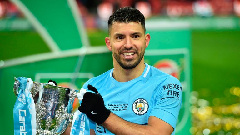 Sergio Aguero holds the Carabao Cup as he poses for a photograph after Manchester City's 3-0 defeat of Arsenal