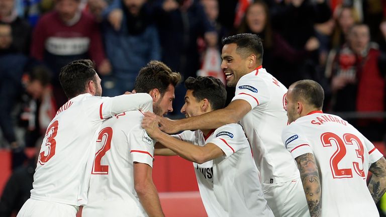 Sevilla's Italian midfielder Franco Vazquez (2L) celebrates with teammates after scoring a goal during the Spanish 'Copa del Rey' (King's cup) second leg s