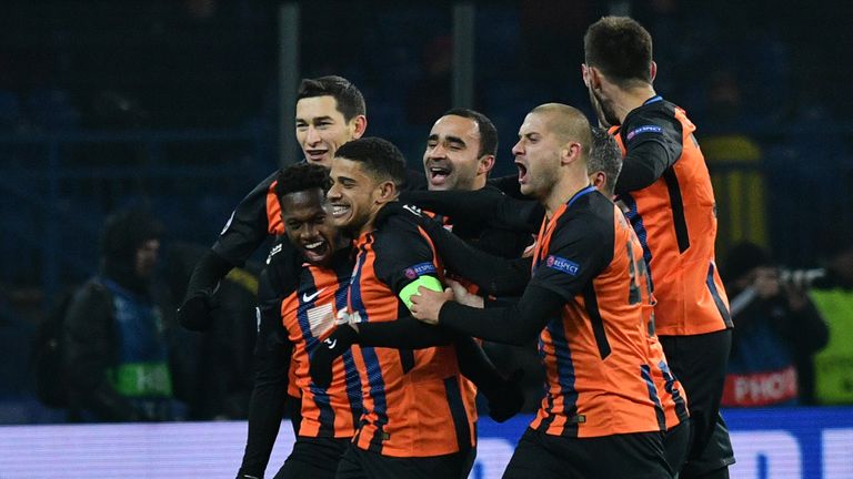 Shakhtar Donetsk's players celebrate the goal scored by midfielder Fred (2L) during the match against Roma 