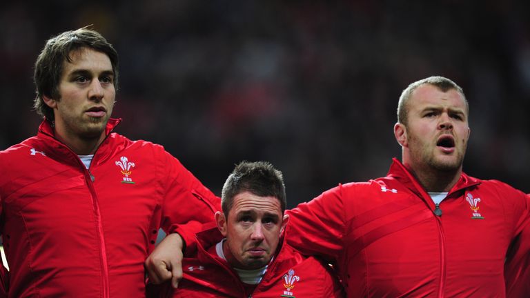 CARDIFF, WALES - DECEMBER 03:  Wales wing Shane Williams (c) sheds a tear during the national anthem flanked by Ryan Jones (l) and Scott Andrew before the 