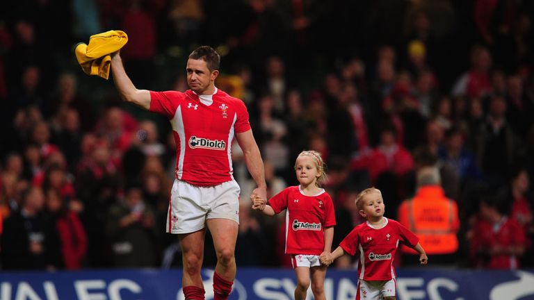 CARDIFF, WALES - DECEMBER 03:  Wales wing Shane Williams waves to the crowd with his children on his lap of honour after the Test match between Wales and t