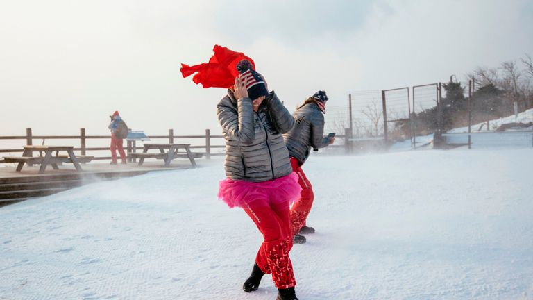 US fans brave the wind as the start of the Alpine Skiing Women's Slalom was delayed due to weather conditions at the Jeongseon Alpine Center