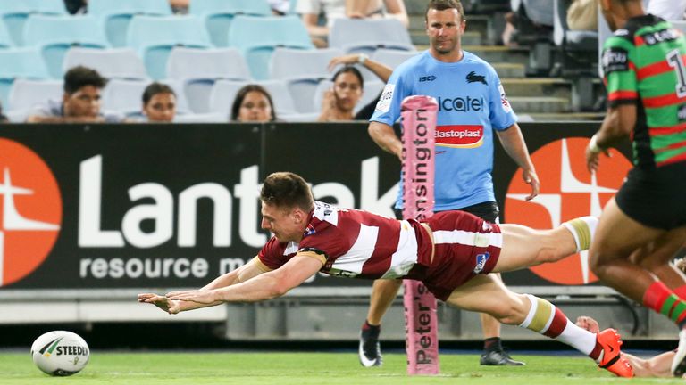 Tom Davies dives for the ball in Australia against South Sydney Rabbitohs