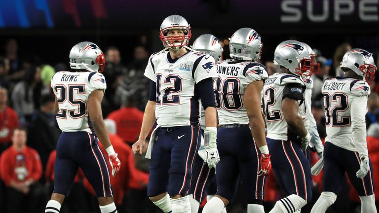 Tom Brady walks off the field after New England Patriots lose to the Philadelphia Eagles 41-33 in Super Bowl LII