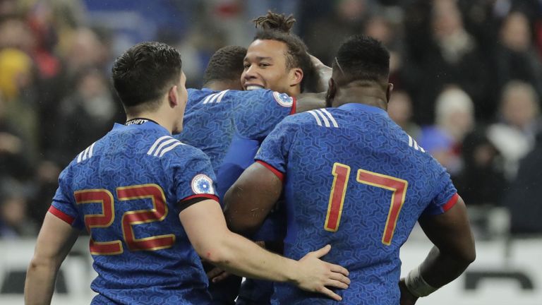 France's wing Teddy Thomas celebrates with teammates after scoring a try during the Six Nations rugby union match between France and Ireland at the Stade d