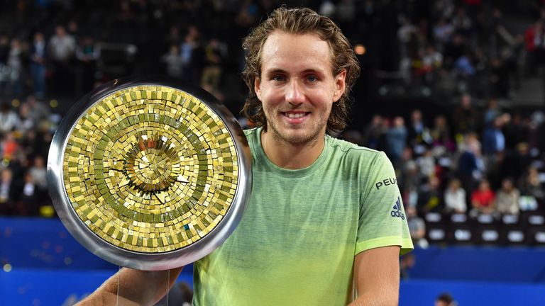 France's tennis player Lucas Pouille poses with his trophy after winning the final of the ATP World Tour Open Sud de France in Montpellier, southern France