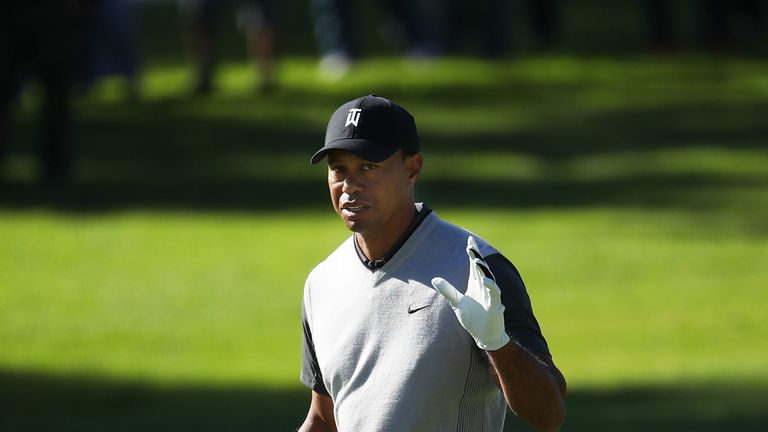 PACIFIC PALISADES, CA - FEBRUARY 15:  Tiger Woods acknowledges fans on the 17th hole during the first round of the Genesis Open at Riviera Country Club on 