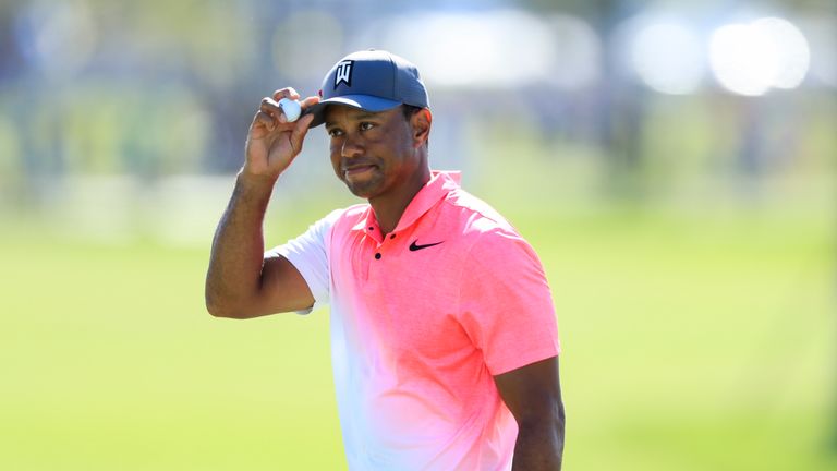 PALM BEACH GARDENS, FL - FEBRUARY 23:  Tiger Woods acknowledges the crowd on the ninth hole during the second round of the Honda Classic at PGA National Re