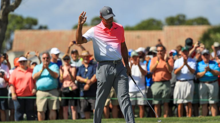 PALM BEACH GARDENS, FL - FEBRUARY 23: Tiger Woods acknowledges the crowd on the fourth green during the second round of the Honda Classic at PGA National R