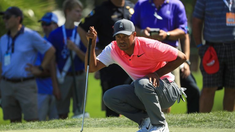 PALM BEACH GARDENS, FL - FEBRUARY 23: Tiger Woods lines up a putt on the third green during the second round of the Honda Classic at PGA National Resort an