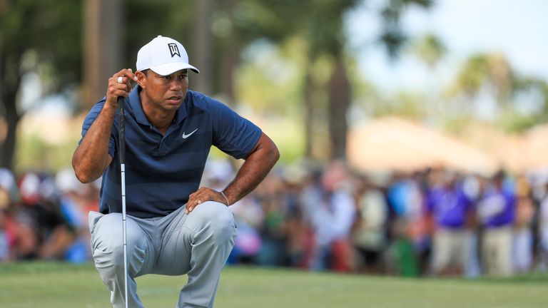 PALM BEACH GARDENS, FL - FEBRUARY 24: Tiger Woods lines up his putt on the third green during the third round of the Honda Classic at PGA National Resort a