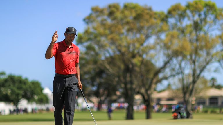 PALM BEACH GARDENS, FL - FEBRUARY 25:  Tiger Woods acknowledges the crowd after a putt on the fourth hole during the final round of the Honda Classic at PG
