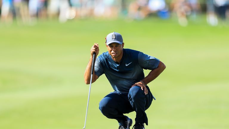 PALM BEACH GARDENS, FL - FEBRUARY 22:  Tiger Woods lines up a putt on 18th during the first round of the Honda Classic at PGA National Resort and Spa on Fe