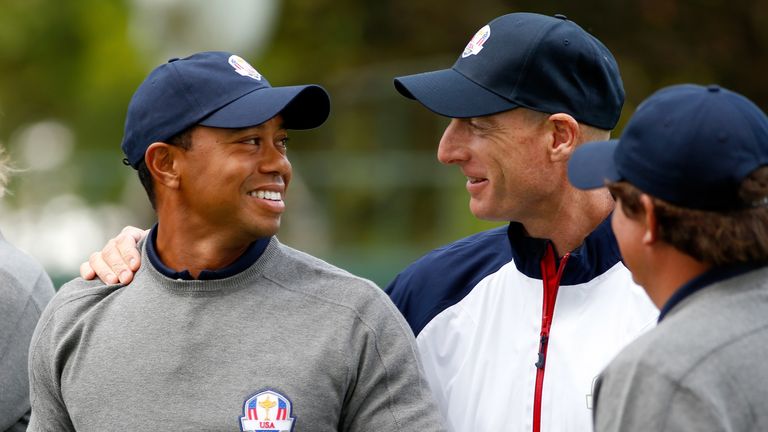 MEDINAH, IL - SEPTEMBER 25:  Tiger Woods talks with Jim Furyk during the USA team photocall during the second preview day of The 39th Ryder Cup at Medinah 