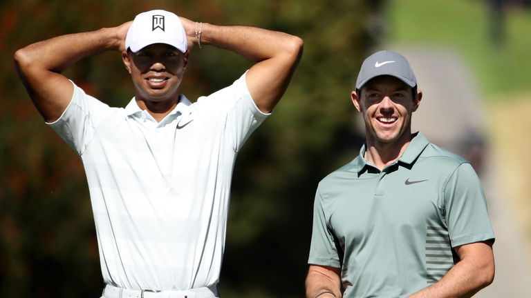 PACIFIC PALISADES, CA - FEBRUARY 16:  Tiger Woods and Rory McIlroy of Northern Ireland meet at the fourth tee during the second round of the Genesis Open a