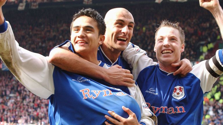 Tim Cahill, Daniele Dichio and Neil Harris celebrate at full-time after winning the FA Cup match between Sunderland and Millwall at Old Trafford