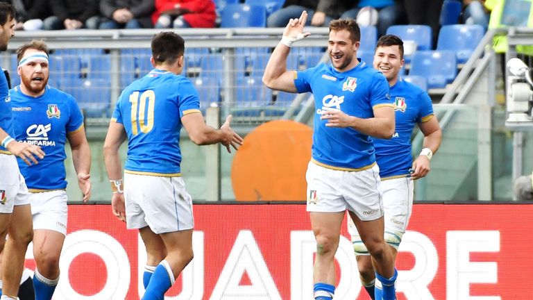 Tommaso Benvenuti celebrates after scoring his try against England