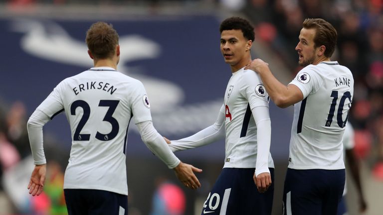 Dele Alli of Tottenham Hotspur celebrates with Harry Kane and Christian Eriksen of Tottenham during the Premier League match