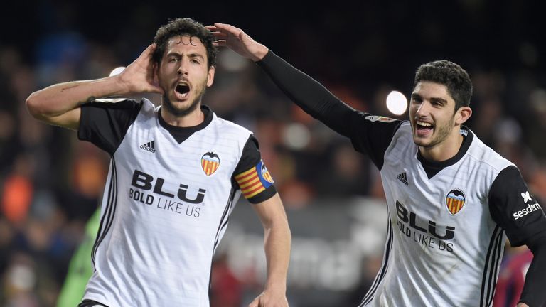 Valencia's midfielder Dani Parejo (L) celebrates with Valencia's Portuguese midfielder Manuel Guedes after scoring during the Spanish league football match