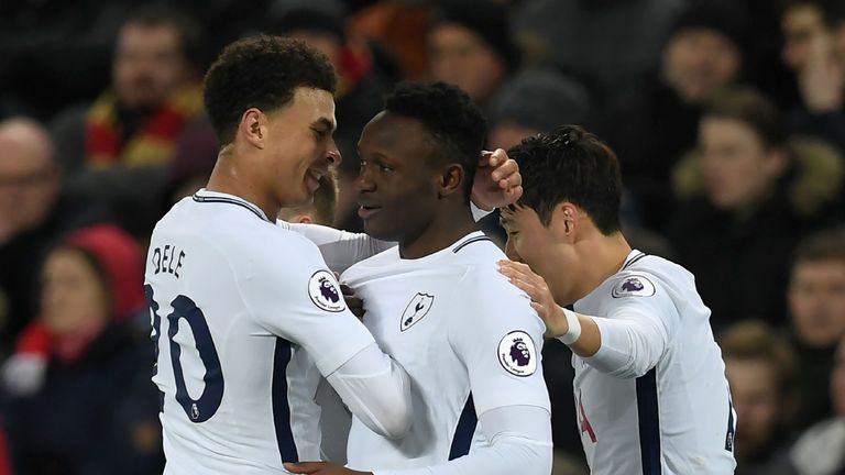 Tottenham Hotspur's Kenyan midfielder Victor Wanyama (C) celebrates scoring his team's first goal with Tottenham Hotspur's English midfielder Dele Alli (L)