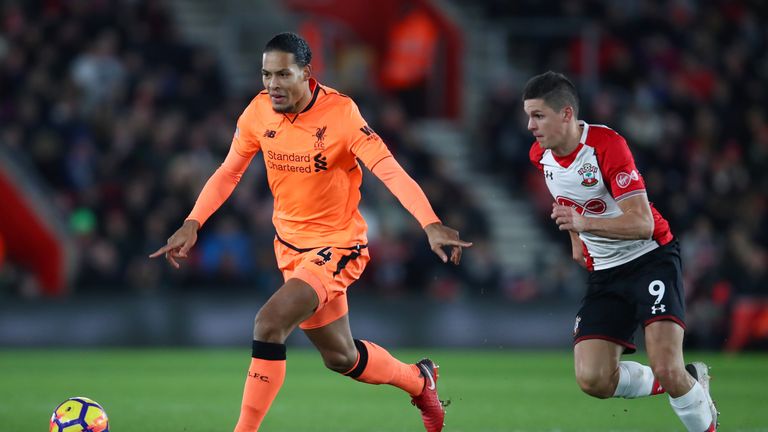 SOUTHAMPTON, ENGLAND - FEBRUARY 11:  Virgil van Dijk of Liverpool battles for possesion with Guido Carrillo of Southampton during the Premier League match 