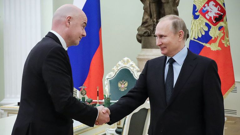 FIFA's president Gianni Infantino (L) shakes hands with Russian President Vladimir Putin during their meeting at the Kremlin in Moscow on February 12, 2018