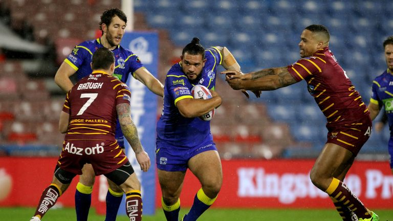 Warrington's Ben Murdoch-Masila is challenged by Huddersfield Giants Danny Brough and Jordan Turner 