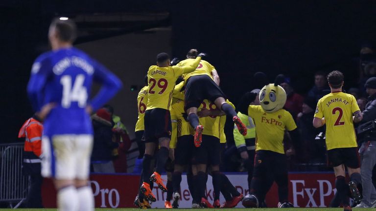Watford's English striker Troy Deeney celebrates with teammates after scoring the winning goal during the English Premier League football match between Wat