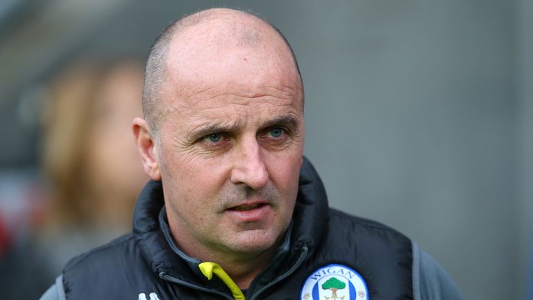 Wigan manager Paul Cook expects a febrile atmosphere against Manchester City