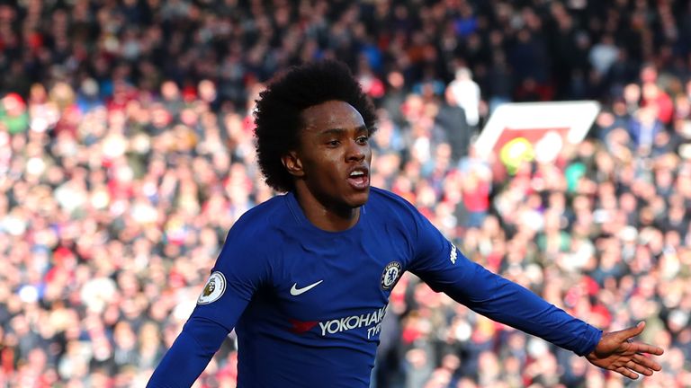 MANCHESTER, ENGLAND - FEBRUARY 25:  Willian of Chelsea celebrates after scoring his sides first goal during the Premier League match between Manchester Uni