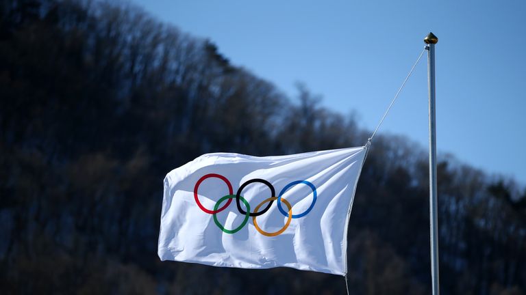 The Olympic flag flaps in the wind in Pyeongchang