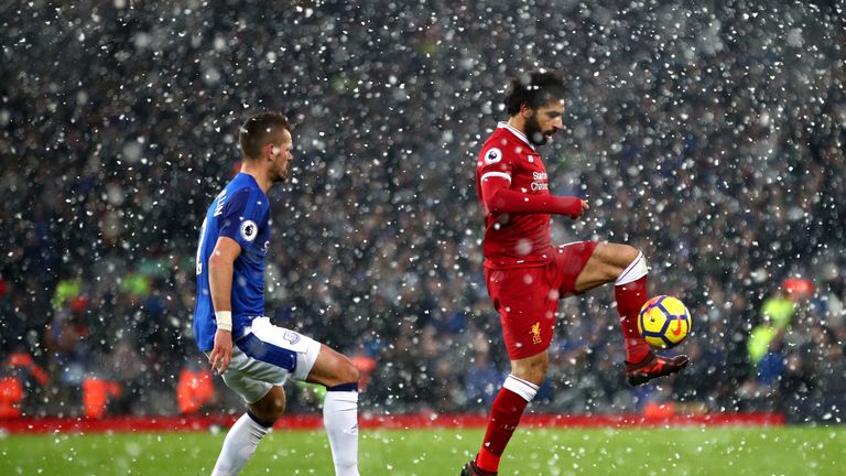 LIVERPOOL, ENGLAND - DECEMBER 10:  Mohamed Salah of Liverpool and Morgan Schneiderlin of Everton in action during the Premier League match between Liverpoo