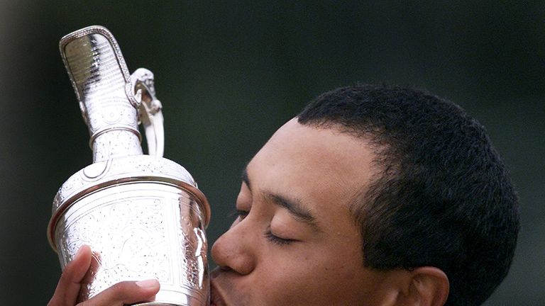 ST. ANDREWS, UNITED KINGDOM:  Tiger Woods of the US kisses the winner's claret jug trophy after his victory in the British Open Championship 23 July 2000. 