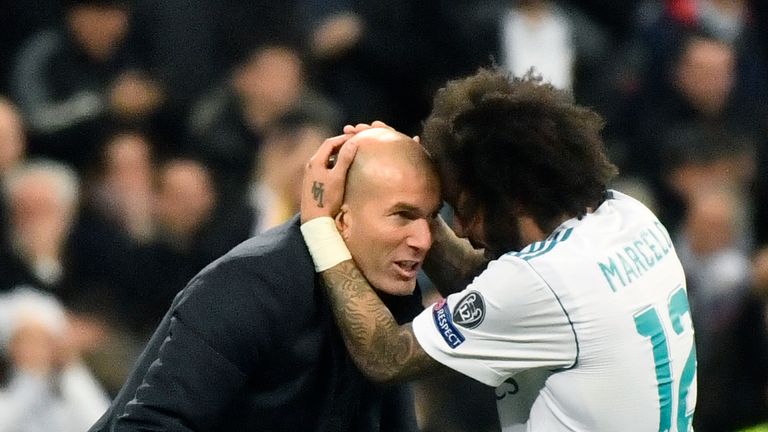 Real Madrid's Brazilian defender Marcelo (R) celebrates with Real Madrid's French coach Zinedine Zidane after scoring during the UEFA Champions League roun