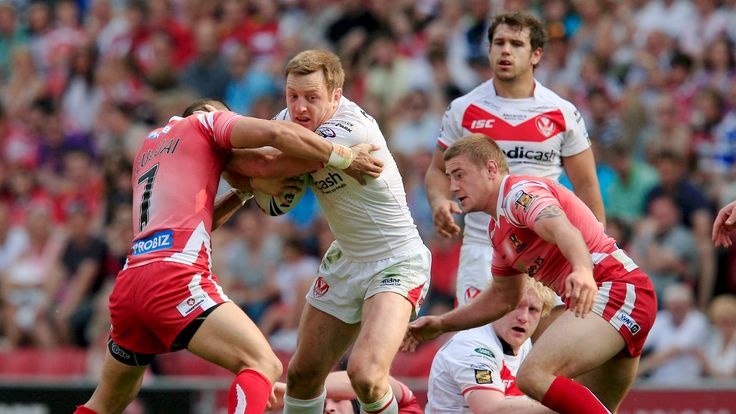 Wigan's Thomas Leuluai tackles St Helens James Roby