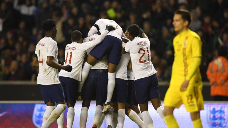 England players celebrate after taking the lead at Molineux