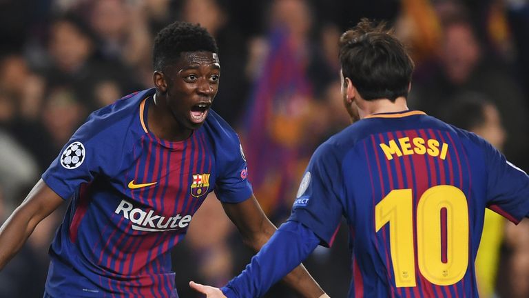 Ousmane Dembele celebrates with Lionel Messi