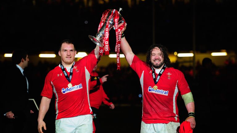 Wales players Gethin Jenkins (l) and Adam Jones celebrate with the Six Nations trophy