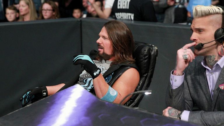 AJ Styles was in no rush to leave his commentary position as Rusev and Aiden English attacked Shinsuke Nakamura