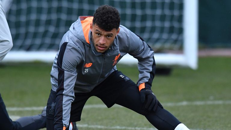 Alex Oxlade-Chamberlain warms up during Liverpool training at Melwood