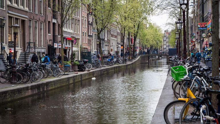View of a canal in the red district in Amsterdam on April 12, 2017