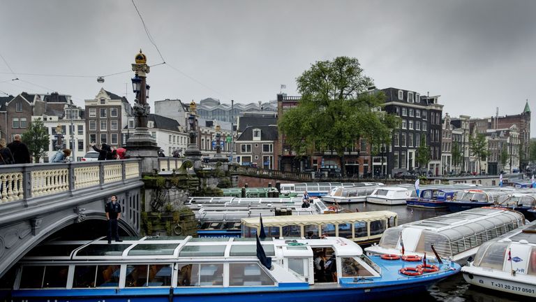 Sightseeing boats and canal boats demonstrate by blocking the canals of Amsterdam, on June 20, 2016 against the new policy of the municipality to ensure that all 135 boats over 14 meters will be banned from the canals