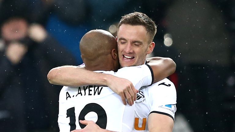 Andy King is congratulated by teammate Andre Ayew after making it 3-0