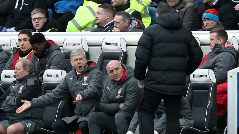 Arsene Wenger gestures on the touchline at the Amex Stadium