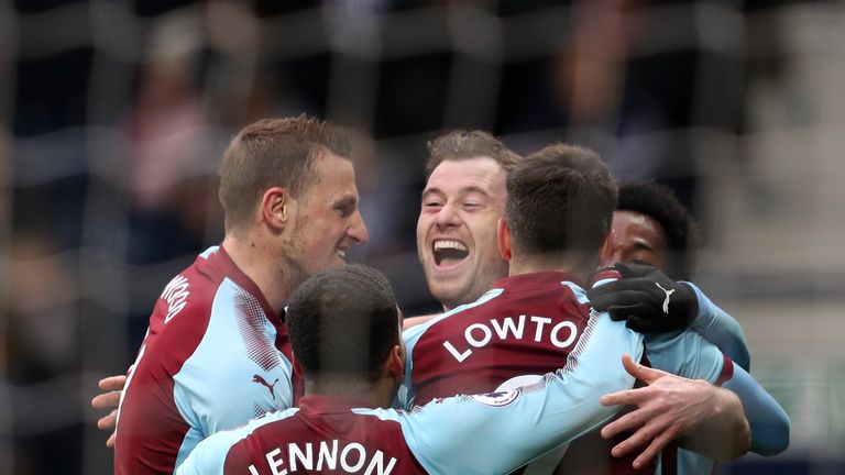 Burnley's Ashley Barnes (centre) celebrates scoring his side's first goal of the game during the Premier League match at The Hawthorns, West Bromwich