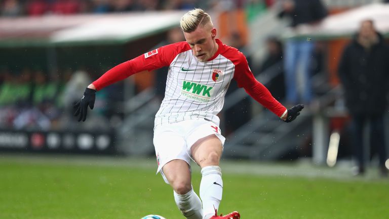 of Augsburg battles for the ball with of Freiburg during the Bundesliga match between FC Augsburg and Sport-Club Freiburg at WWK-Arena on December 16, 2017 in Augsburg, Germany.