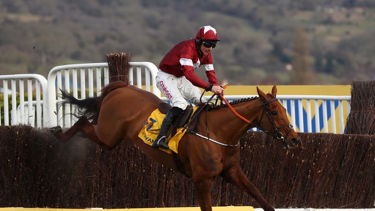 Balko Des Flos ridden by Davy Russell jumps the last on their way to victory in the Ryanair Chase